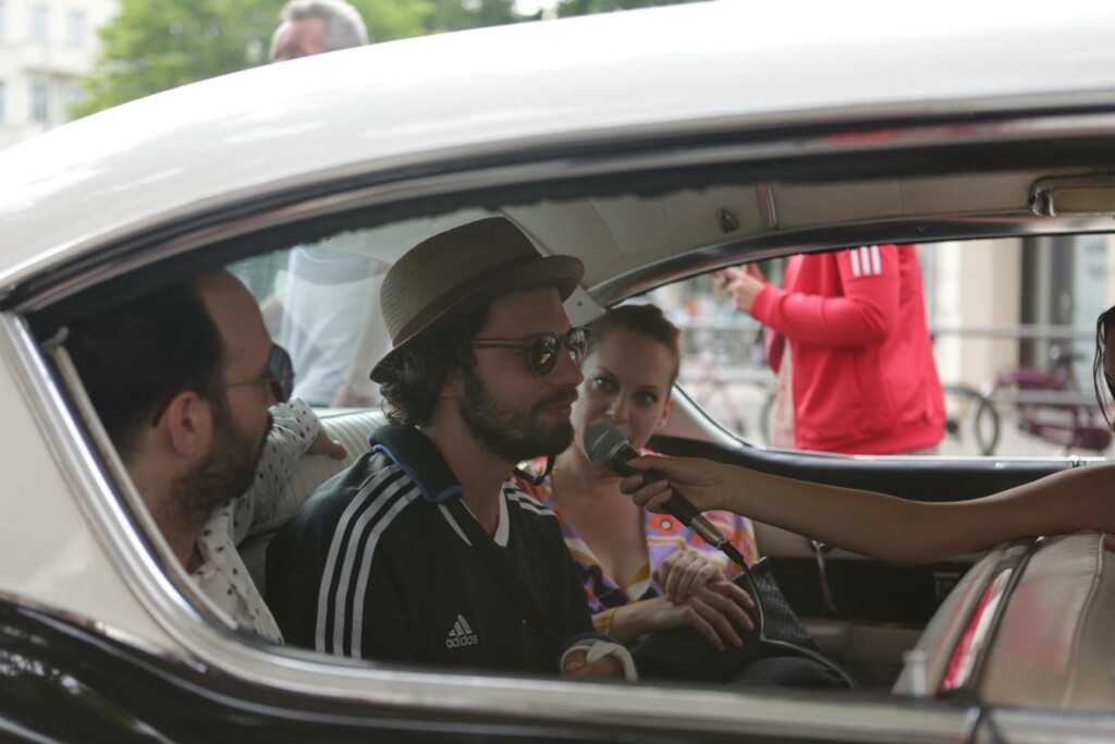 Artist-in-vintage-car-interview-red-carpet
